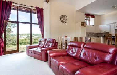 The vaulted lounge with log burner